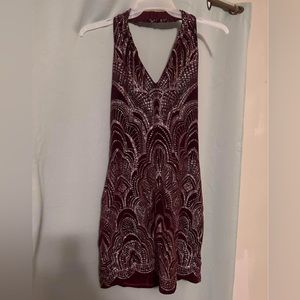 From the brand “Jump” this is a sangria red with glittery gold details